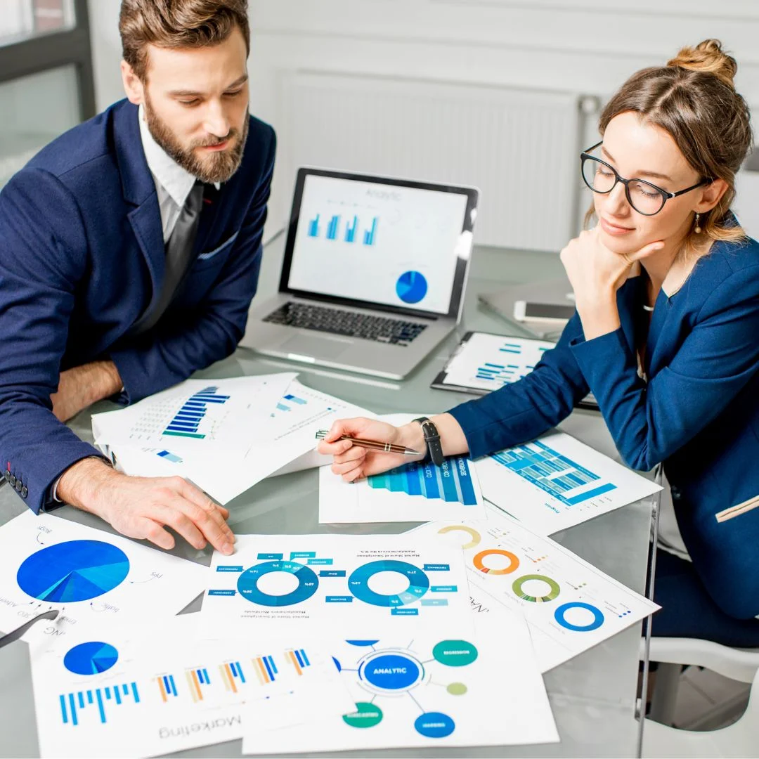 a man and woman in a digital marketing agency in dallas working on SEO and PPC campaigns