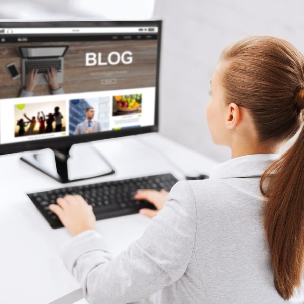 Woman editing blog on a Computer
