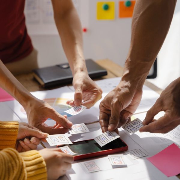 An SEO Agency Team Brainstorming on Office Desk