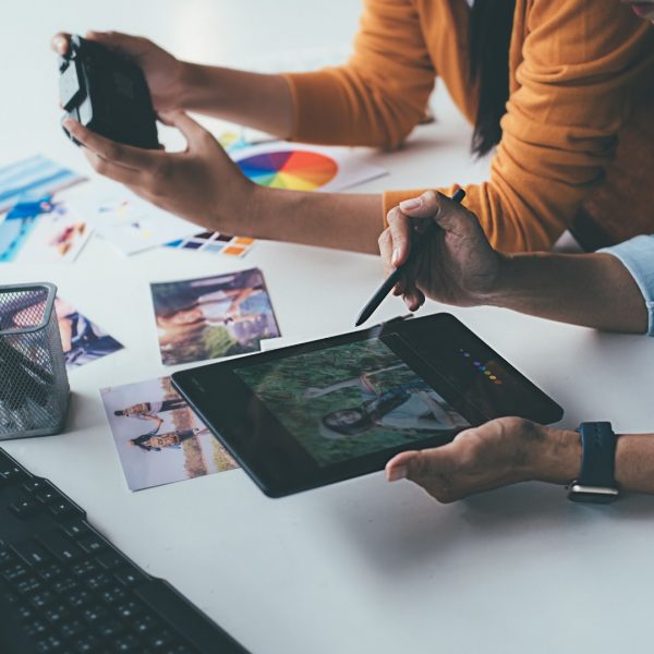 designers in a seo social media agency are working on a social media post design